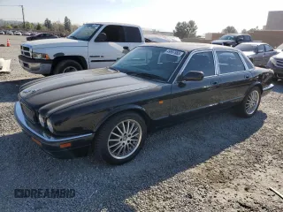 1996 Jaguar XJ with VIN SAJPX1147TC784778, listed as a Copart auction lot 49997885 with 209,185 mi miles and Clean title. Bid and sale history available at DreamBid. Image 1.