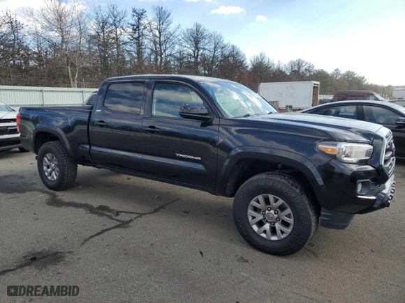 2016 Toyota Tacoma SR5 with VIN 3TMDZ5BN2GM002949, listed as a Copart auction lot 43263985 with 136,748 mi miles and Salvage Title. Bid and sale history available at carsss.com. Image 4.