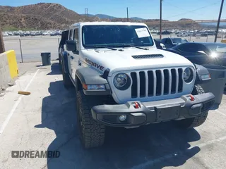 2022 Jeep Gladiator Mojave with VIN 1C6JJTEG4NL146228, listed as a IAAI auction lot 42613786 with 23,795 mi miles and . Bid and sale history available at DreamBid. Image 1.