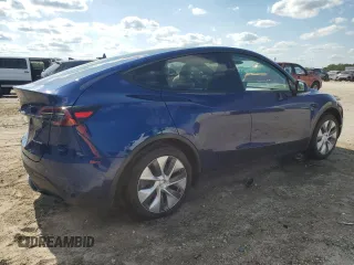 2023 Tesla Model Y Long Range z VIN 7SAYGDEE3PA178832, wystawiony jako Copart lot #57156005 z przebiegiem 12 920 mil mil oraz Szkody całkowita. Historia ofert i sprzedaży dostępna na DreamBid. Obrazek 3.