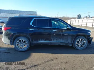 2018 Chevrolet Traverse Premier z VIN 1GNEVJKW5JJ174261, wystawiony jako IAAI lot #41656906 z przebiegiem 101 908 mil mil oraz . Historia ofert i sprzedaży dostępna na DreamBid. Obrazek 13.