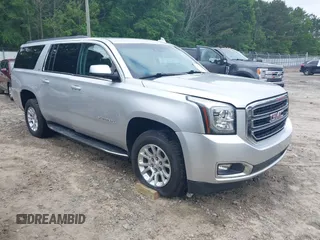 2019 GMC Yukon XL SLT z VIN 1GKS1GKC0KR242408, wystawiony jako IAAI lot #42144783 z przebiegiem Nie podano mil oraz . Historia ofert i sprzedaży dostępna na DreamBid. Obrazek 1.