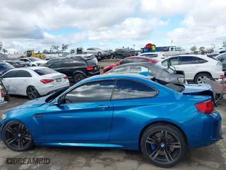 2017 BMW M2 with VIN WBS1H9C53HV887089, listed as a IAAI auction lot 41731841 with 57,509 mi miles. Bid and sale history available at carsss.com. Image 14.