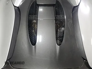 2018 McLaren 570S z VIN SBM13FAA2JW004594, wystawiony jako Copart lot #49730155 z przebiegiem Nie podano mil oraz Szkody całkowita. Historia ofert i sprzedaży dostępna na DreamBid. Obrazek 11.