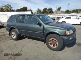 2004 Isuzu Rodeo S with VIN 4S2CK58W344303242, listed as a Copart auction lot 75339714 with 106,659 mi miles and Salvage title. Bid and sale history available at DreamBid. Image 4.