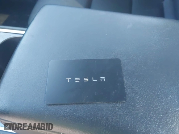 2023 Tesla Model Y Long Range z VIN 7SAYGAEE5PF603128, wystawiony jako IAAI lot #41328797 z przebiegiem 63 527 mil mil oraz . Historia ofert i sprzedaży dostępna na DreamBid. Obrazek 11.