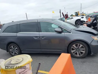 2014 Honda Odyssey Touring with VIN 5FNRL5H97EB114634, listed as a IAAI auction lot 42105220 with Not Provided miles and . Bid and sale history available at carsss.com. Image 12.