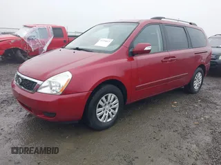 2011 Kia Sedona LX with VIN KNDMG4C71B6411453, listed as a IAAI auction lot 41316825 with 261,028 mi miles. Bid and sale history available at carsss.com. Image 2.