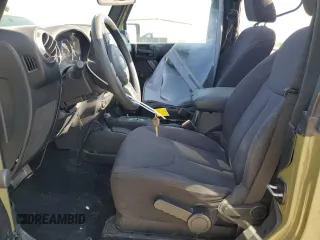 2013 Jeep Wrangler Sport with VIN 1C4AJWAG3DL649487, listed as a Copart auction lot 52568285 with 106,644 mi miles and Salvage title. Bid and sale history available at DreamBid. Image 7.
