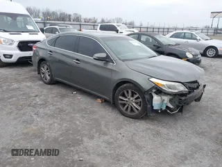2014 Toyota Avalon Limited with VIN 4T1BK1EB0EU084433, listed as a IAAI auction lot 41434826 with 166,964 mi miles. Bid and sale history available at carsss.com. Image 1.