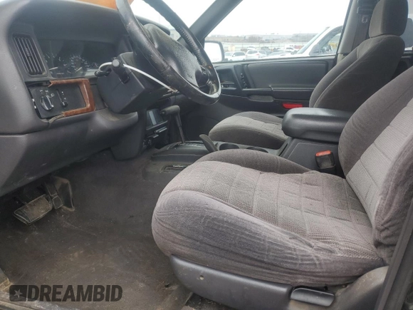 1998 Jeep Grand Cherokee Laredo with VIN 1J4GZ58S2WC281923, listed as a Copart auction lot 44010885 with 210,959 mi miles and Salvage Title. Bid and sale history available at carsss.com. Image 7.