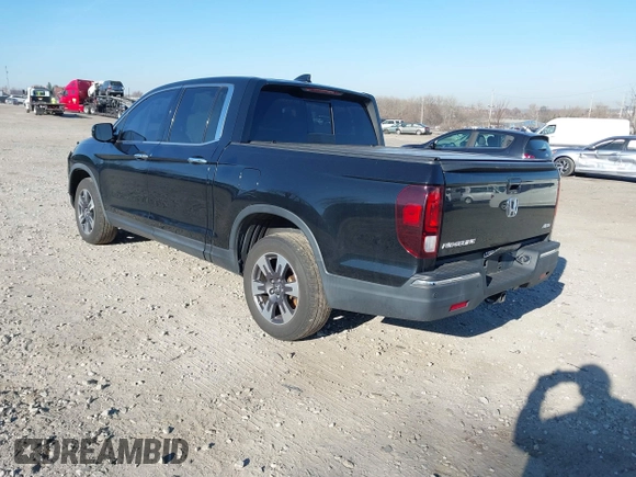 2019 Honda Ridgeline RTL-E with VIN 5FPYK3F7XKB033652, listed as a IAAI auction lot 41751421 with 96,774 mi miles and . Bid and sale history available at DreamBid. Image 3.