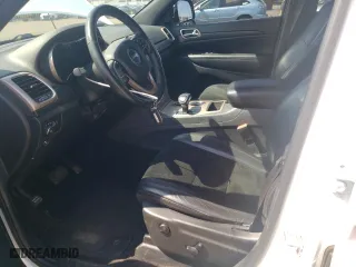 2015 Jeep Grand Cherokee Altitude with VIN 1C4RJFAG0FC725933, listed as a Copart auction lot 52714805 with 119,550 mi miles and Salvage Title. Bid and sale history available at carsss.com. Image 7.