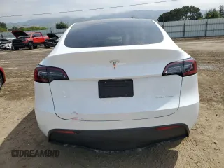 2023 Tesla Model Y Long Range z VIN 7SAYGDEE3PF815088, wystawiony jako Copart lot #54849895 z przebiegiem 19 637 mil mil oraz Szkoda całkowita • Salvage title. Historia ofert i sprzedaży dostępna na DreamBid. Obrazek 6.