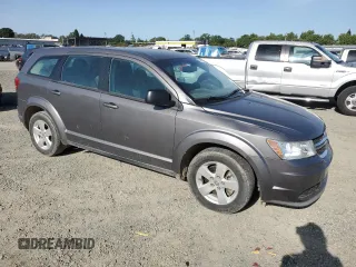 2013 Dodge Journey American Value with VIN 3C4PDCAB8DT590509, listed as a Copart auction lot 57347375 with 203,642 mi miles and Clean title. Bid and sale history available at DreamBid. Image 4.