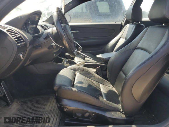2012 BMW 1 Series 135i with VIN WBAUC9C52CVM12915, listed as a Copart auction lot 67145834 with 114,306 mi miles and Salvage title. Bid and sale history available at DreamBid. Image 7.