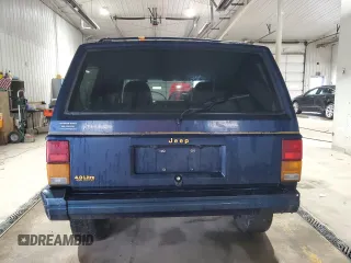 1995 Jeep Cherokee z VIN 1J4FN78S7SL537213, wystawiony jako Copart lot #58700105 z przebiegiem 261 606 mil mil oraz Szkoda całkowita • Salvage title. Historia ofert i sprzedaży dostępna na DreamBid. Obrazek 6.
