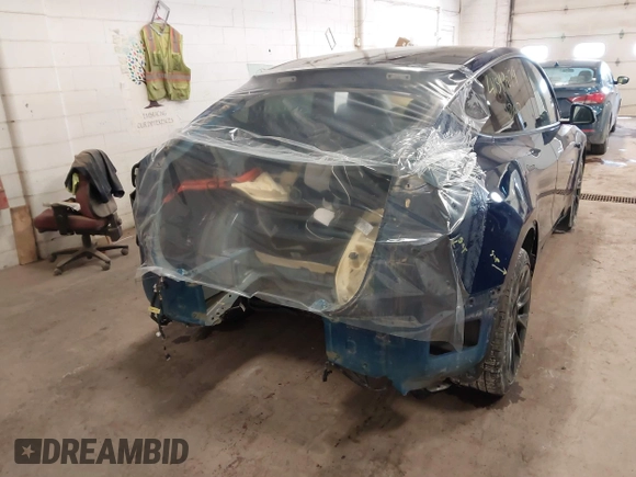 2021 Tesla Model Y Long Range with VIN 5YJYGDEE2MF185945, listed as a IAAI auction lot 41599029 with 53,815 mi miles and . Bid and sale history available at DreamBid. Image 6.