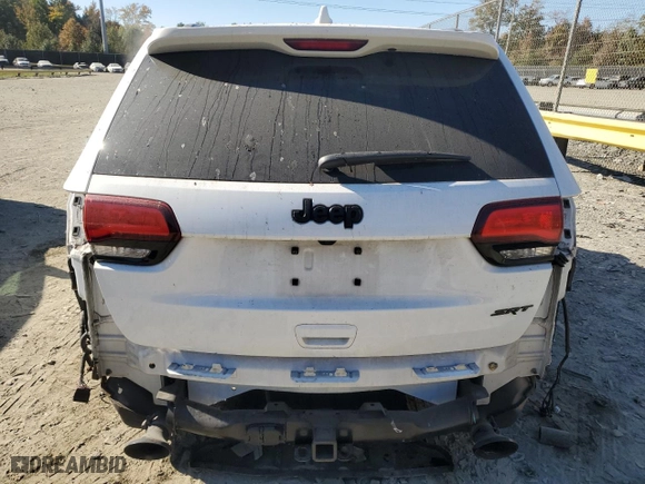 2021 Jeep Grand Cherokee SRT with VIN 1C4RJFDJ5MC584989, listed as a Copart auction lot 71048734 with 68,774 mi miles and Salvage Title. Bid and sale history available at carsss.com. Image 6.