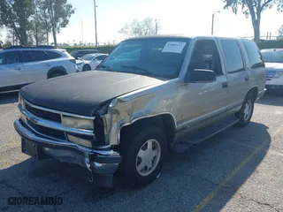 1999 Chevrolet Tahoe with VIN 1GNEC13R8XJ527499, listed as a IAAI auction lot 41880157 with 186,342 mi miles. Bid and sale history available at carsss.com. Image 2.