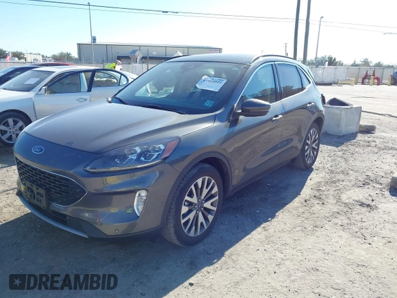 2020 Ford Escape Titanium with VIN 1FMCU9J9XLUA66440, listed as a IAAI auction lot 41464049 with 57,626 mi miles and . Bid and sale history available at DreamBid. Image 17.