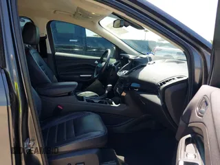 2017 Ford Escape Titanium with VIN 1FMCU0J97HUE07747, listed as a IAAI auction lot 41977788 with 104,560 mi miles. Bid and sale history available at carsss.com. Image 5.