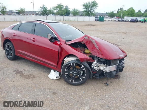 2022 Kia K5 GT-Line z VIN 5XXG64J29NG121197, wystawiony jako IAAI lot #39659829 z przebiegiem 49 590 mil mil oraz . Historia ofert i sprzedaży dostępna na DreamBid. Obrazek 1.