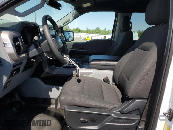 2023 Ford F-150 Lightning Pro with VIN 1FT6W1EVXPWG44972, listed as a Copart auction lot 60303485 with 19,788 mi miles and Salvage title. Bid and sale history available at DreamBid. Image 7.