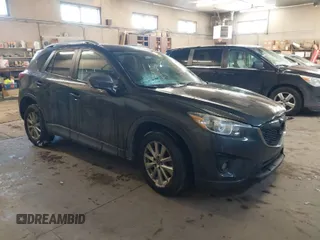 2015 Mazda CX-5 Touring with VIN JM3KE2CY2F0458114, listed as a IAAI auction lot 41545493 with 138,061 mi miles. Bid and sale history available at carsss.com. Image 1.