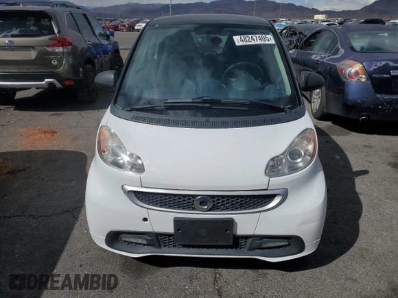 2015 Smart fortwo Passion z VIN WMEEJ3BA5FK812094, wystawiony jako Copart lot #48247405 z przebiegiem 79 913 mil mil oraz Szkody całkowita. Historia ofert i sprzedaży dostępna na DreamBid. Obrazek 5.