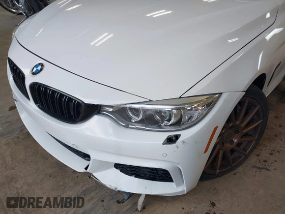 2015 BMW 4 Series 435i xDrive z VIN WBA4B3C53FD669771, wystawiony jako IAAI lot #41835401 z przebiegiem 145 570 mil mil oraz . Historia ofert i sprzedaży dostępna na DreamBid. Obrazek 6.
