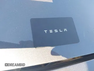2023 Tesla Model 3 with VIN 5YJ3E1EA9PF673399, listed as a IAAI auction lot 42392643 with 7,571 mi miles and . Bid and sale history available at DreamBid. Image 11.