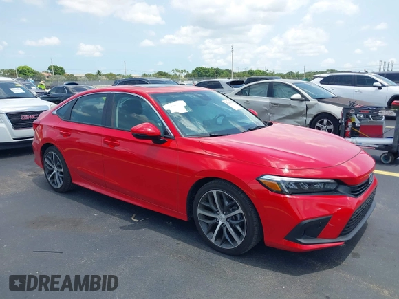 2023 Honda Civic Touring with VIN 2HGFE1F94PH323451, listed as a IAAI auction lot 42383422 with 6,120 mi miles and . Bid and sale history available at DreamBid. Image 1.