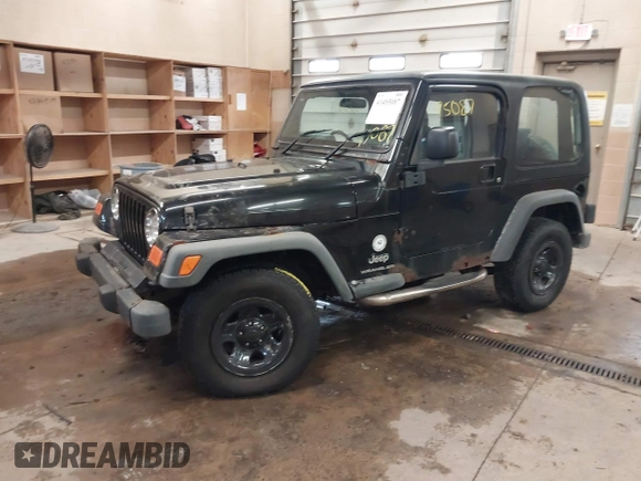 2003 Jeep Wrangler Sport Right Hand Drive with VIN 1J4F449S63P359031, listed as a IAAI auction lot 41495087 with 126,678 mi miles. Bid and sale history available at carsss.com. Image 17.