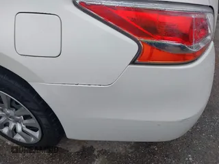 2014 Nissan Altima SV with VIN 1N4AL3AP7EN354056, listed as a IAAI auction lot 42101489 with 206,245 mi miles and . Bid and sale history available at DreamBid. Image 12.