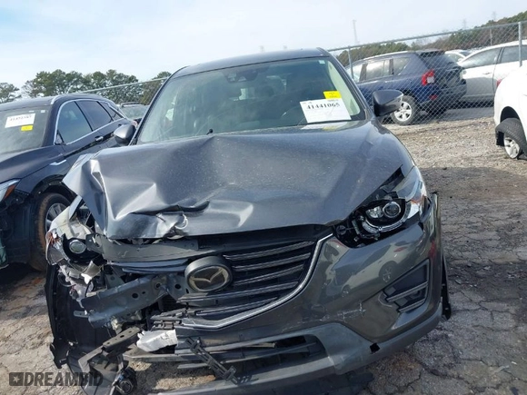 2016 Mazda CX-5 Grand Touring with VIN JM3KE4DY5G0836891, listed as a IAAI auction lot 41441065 with NaN miles. Bid and sale history available at carsss.com. Image 12.