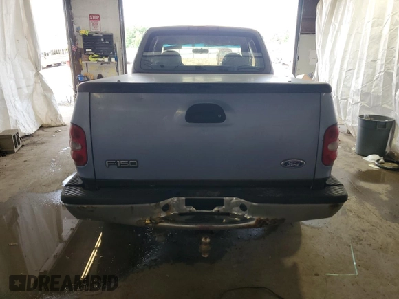 1997 Ford F-150 with VIN 1FTDX076XVKC72073, listed as a Copart auction lot 62774955 with 204,105 mi miles and Salvage title. Bid and sale history available at DreamBid. Image 6.