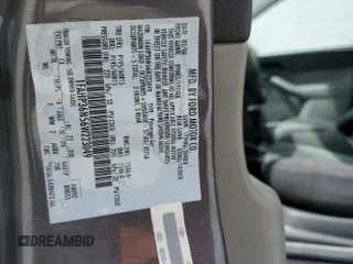 2006 Ford Focus SE with VIN 1FAHP36N56W223049, listed as a Copart auction lot 61211745 with 185,609 mi miles and Salvage title. Bid and sale history available at DreamBid. Image 12.