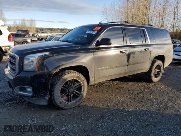 2015 GMC Yukon XL SLT with VIN 1GKS2HKC4FR697416, listed as a Copart auction lot 87887925 with 236,772 mi miles and Salvage Title. Bid and sale history available at carsss.com. Image 1.