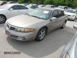2004 Pontiac Bonneville SE z VIN 1G2HX52K04U248925, wystawiony jako IAAI lot #42072378 z przebiegiem 192 653 mil mil oraz . Historia ofert i sprzedaży dostępna na DreamBid. Obrazek 2.
