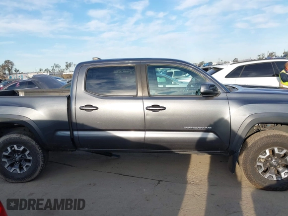 2021 Toyota Tacoma SR5 z VIN 3TMDZ5BN6MM110938, wystawiony jako IAAI lot #41838703 z przebiegiem 67 680 mil mil oraz . Historia ofert i sprzedaży dostępna na DreamBid. Obrazek 13.