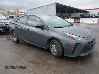 2021 Toyota Prius L Eco with VIN JTDKAMFUXM3143646, listed as a IAAI auction lot 41507110 with 207,238 mi miles. Bid and sale history available at carsss.com. Image 1.