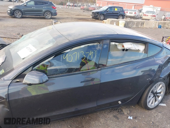 2021 Tesla Model 3 Long Range with VIN 5YJ3E1EB6MF975916, listed as a IAAI auction lot 40713749 with 29,593 mi miles and . Bid and sale history available at DreamBid. Image 6.