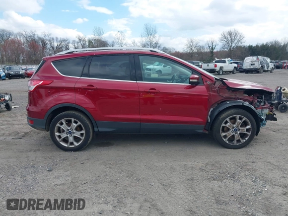 2016 Ford Escape Titanium with VIN 1FMCU9JX2GUA89716, listed as a IAAI auction lot 41899786 with 85,474 mi miles and . Bid and sale history available at DreamBid. Image 13.