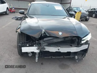 2021 BMW 3 Series 330i with VIN 3MW5R1J07M8B47179, listed as a IAAI auction lot 41450153 with 66,689 mi miles. Bid and sale history available at carsss.com. Image 6.