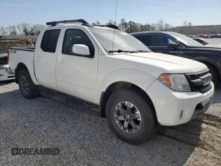 2015 Nissan Frontier Pro-4X with VIN 1N6AD0EV5FN700571, listed as a Copart auction lot 50974615 with 138,930 mi miles and Salvage title. Bid and sale history available at DreamBid. Image 4.