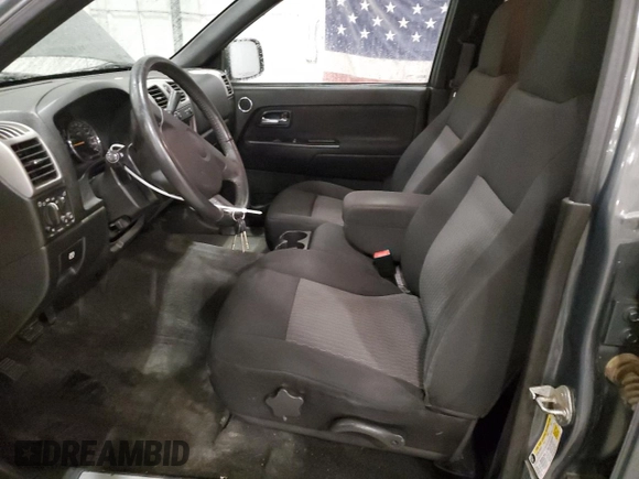 2010 GMC Canyon SLE1 with VIN 1GTJTCDE5A8148716, listed as a Copart auction lot 57559215 with 126,523 mi miles and Salvage title. Bid and sale history available at DreamBid. Image 7.