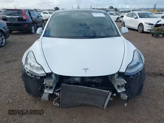 2019 Tesla Model 3 Long Range with VIN 5YJ3E1EBXKF512710, listed as a IAAI auction lot 42063737 with 90,721 mi miles and . Bid and sale history available at DreamBid. Image 13.