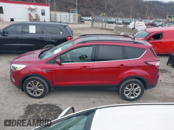 2018 Ford Escape SE z VIN 1FMCU9GD6JUA18684, wystawiony jako IAAI lot #41499540 z przebiegiem 105 127 mil mil oraz . Historia ofert i sprzedaży dostępna na DreamBid. Obrazek 14.