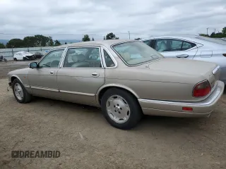 1997 Jaguar XJ Vanden Plas with VIN SAJKX6245VC800386, listed as a Copart auction lot 53651675 with 158,185 mi miles and Salvage Title. Bid and sale history available at DreamBid. Image 2.